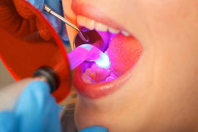 A dentist examining a patient