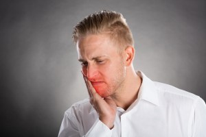 Photo: A man with tooth pain