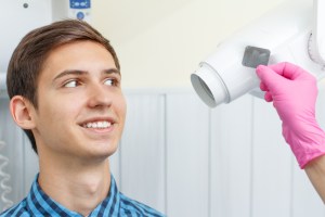 Photo: Relaxed dental patient receiving digital x-rays
