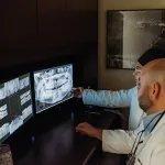 Durham NC Dentists Drs. Hernandez and Lasanta, examining dental patient x-rays