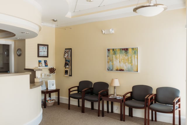 Photo: Dental patient waiting room and reception desk in Durham NC